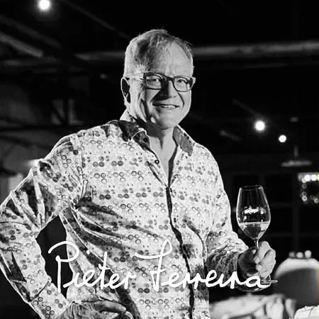 Pieter Ferreira Showcasing A Glass Of Stellenbosch Wine.