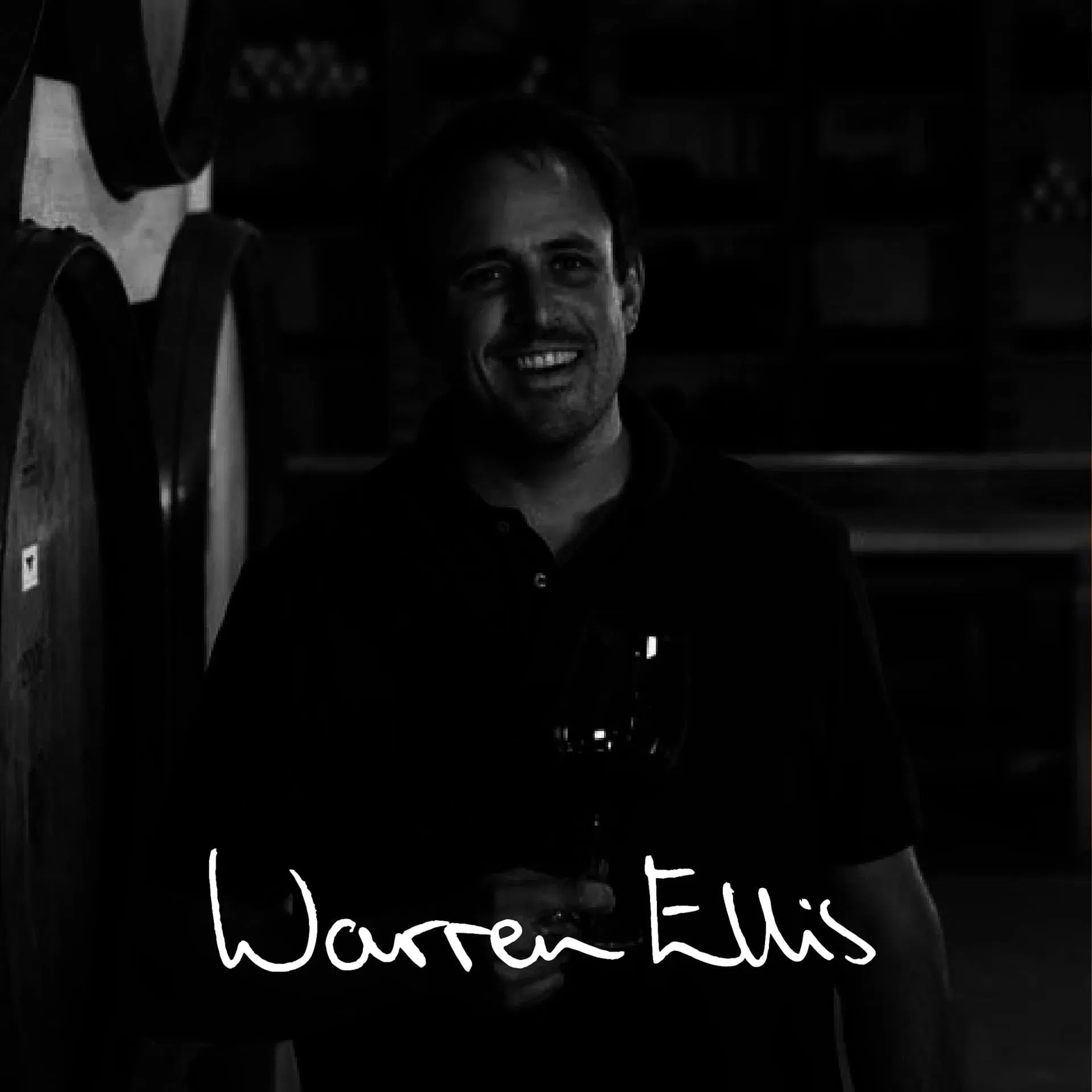 Smiling Winemaker Holding A Glass Of Stellenbosch Wine.
