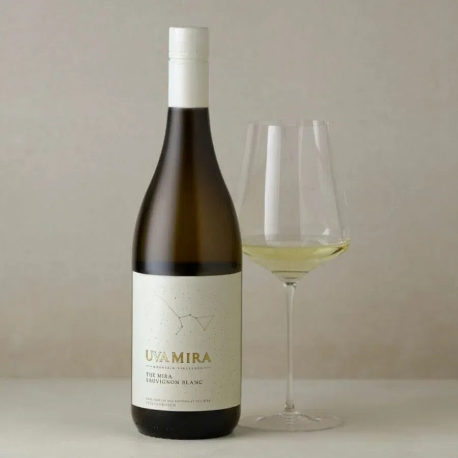 Uva Mira Sauvignon Blanc bottle with a glass of wine, showcasing Stellenbosch wine.