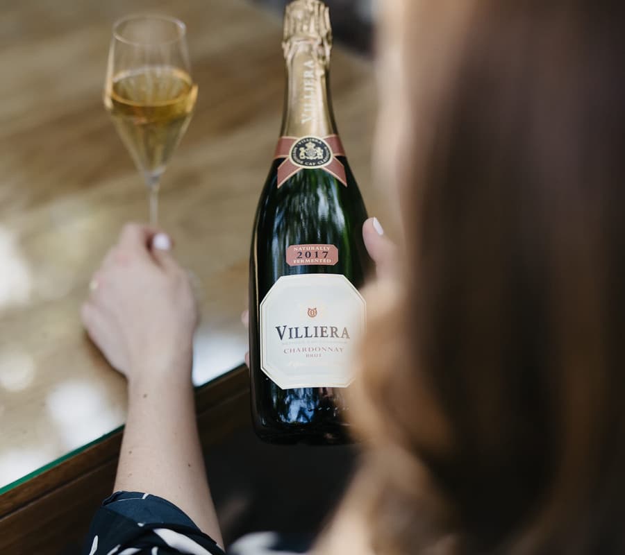 Villiera 2017 Chardonnay Brut With A Glass Of Sparkling Wine.